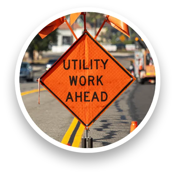 photo of a utility work ahead sign placed by mint city underground work crew